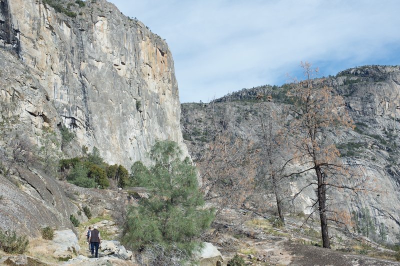 Working our way along the ledge toward the falls, obscured by the rim of the valley.