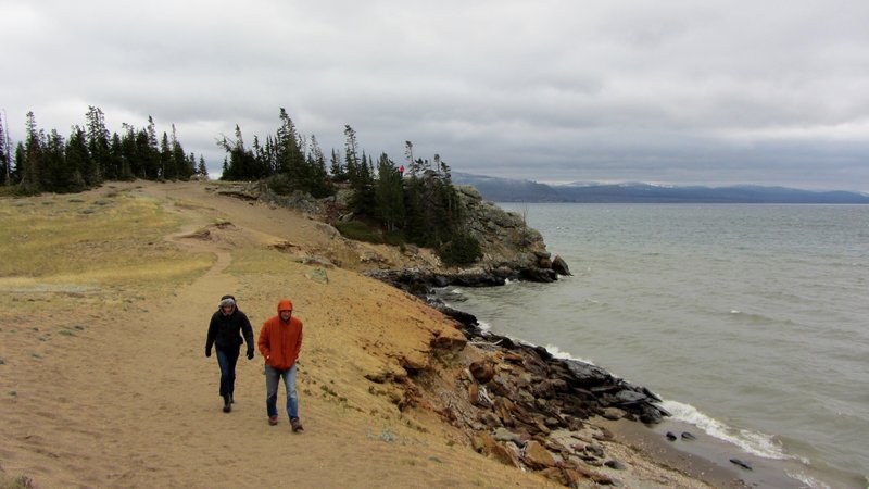 Hikers bundle up as they leave Storm Point on a stormy September afternoon.