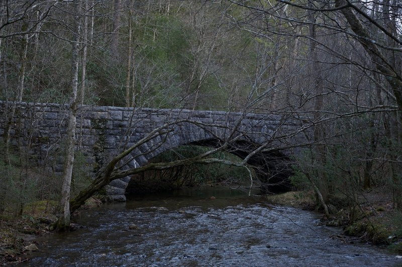 The Laurel Creek Road passes close by the trail as you approach the Schoolhouse Gap parking lot.  This arch bridge crosses Laurel Creek and provides access from Townsend to Cades Cove.