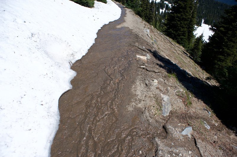 As the snow melts, it covers the trail.   Make sure you wear the appropriate footwear, even in the middle of the summer on clear days.