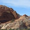 Moab Rim Arch is in the foreground but can you spot tiny Tukunikivatz Arch on the horizon?