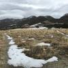 Snow and stormy skies looking back at the visitor center.