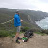 Northward bound backpacker taking in the view with his morning snack.