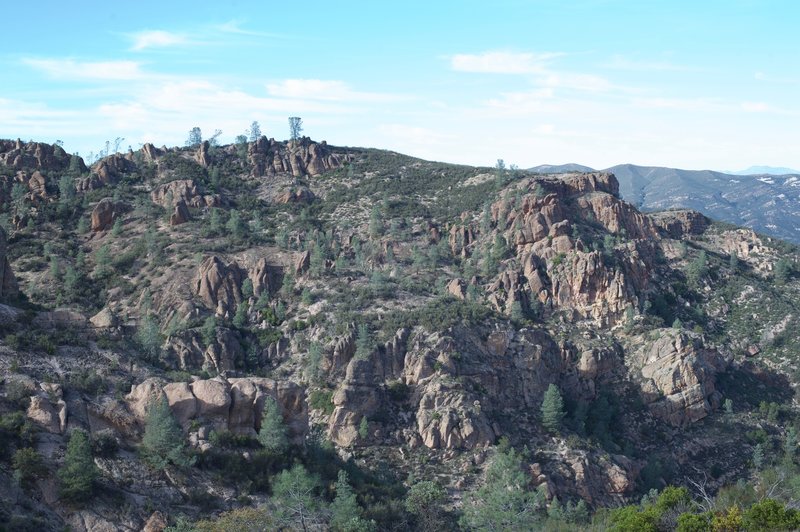 Volcanic rock formations.  The trees start to thin as the trail climbs.