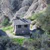 A little outhouse and trash can for hikers who need a break.