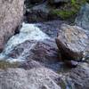 Water working its way around the rock.