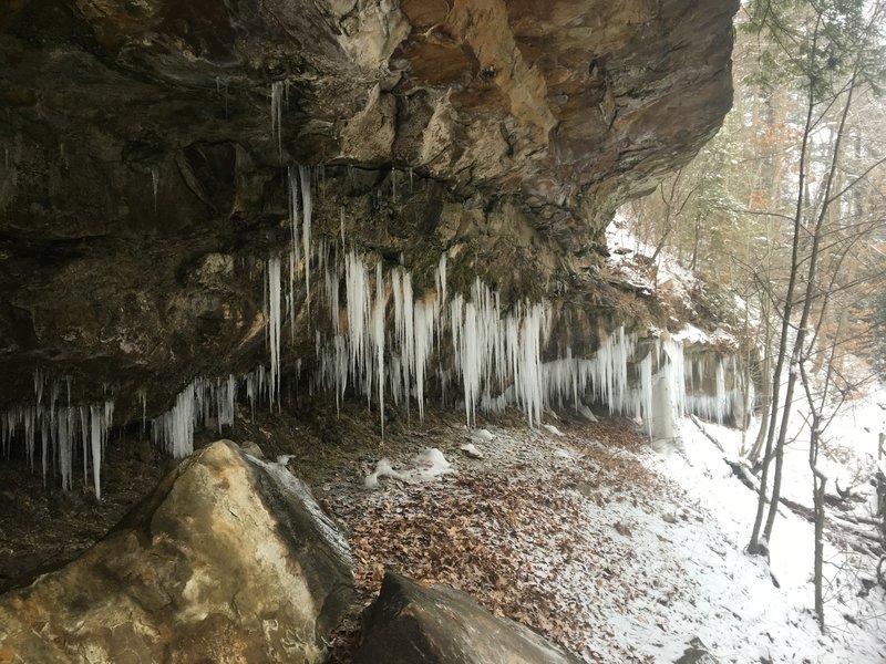 Ice hanging from rock formations created by glaciers.