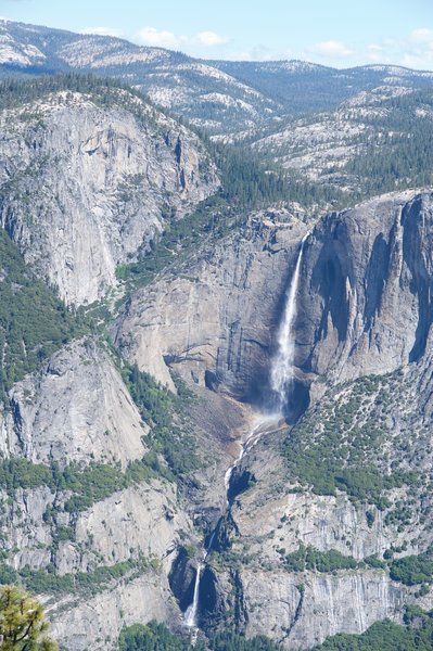 Upper Yosemite Falls, Middle Cascades, and Lower Yosemite Falls. You can see Upper Yosemite Falls Trail snaking its way to the top of the Valley Rim.