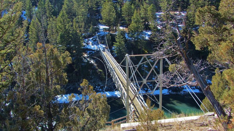 A steel suspension bridge (built in 1936) that crosses the Yellowstone River.