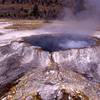 Beautiful Punch Bowl Spring is named for the large geyserite rim that gives the appearance of a punch bowl. Photo courtesy of the National Park Service.