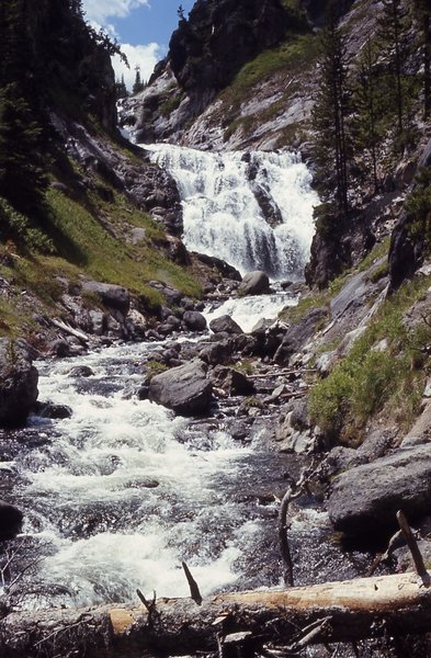 Mystic Falls cascades majestically 70 feet over erosion-resistant canyon rhyolite. It has two sections, each with multiple steps. Photo courtesy of the National Park Service.