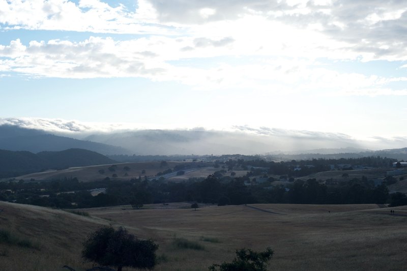 The trail as it descends towards Alpine Road and Interstate 280. Clouds roll along the hills, making for a great view.