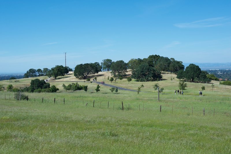 People enjoy the Stanford Dish Loop Trail on a sunny spring day.