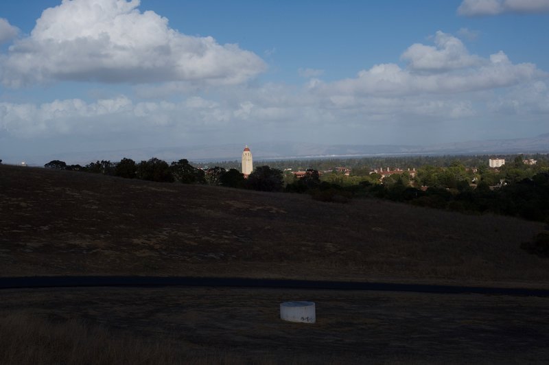 The trail descends and Hoover Tower comes into view again.