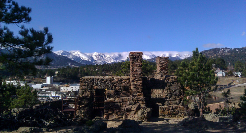 View of the Ruins, the Estes Park theater tower, and RMNP in the distance.