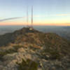 A panoramic view from the top of Directissimo. Ranger Peak Loop continues ahead towards the top of the Wyler Aerial Tramway, in the center of the picture. The southern suburbs of El Paso are visible beyond the mountains. Ciudad Juarez and the Sierra Madre range extend off into the distance.