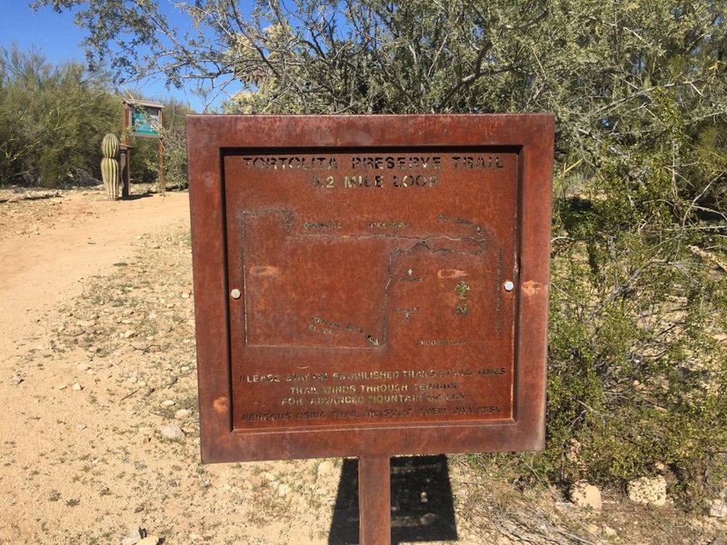 This sign lets you know you've found the trailhead.  The mileage here and throughout the trail does seem a bit short though compared with multiple GPS tracks.