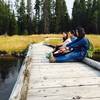 Resting on a boardwalk along the Shoshone Lake Trail.