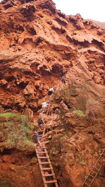 Climbing down to Mooney Falls.