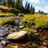 A stream flowing into Beauty Lake. with permission from Hobbes7714 Photo Credit: Andrew Wahr  Link: https://twitter.com/WahrAndrew