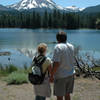 A couple enjoys a view of Lassen Peak from the southern shore of Manzanita Lake.