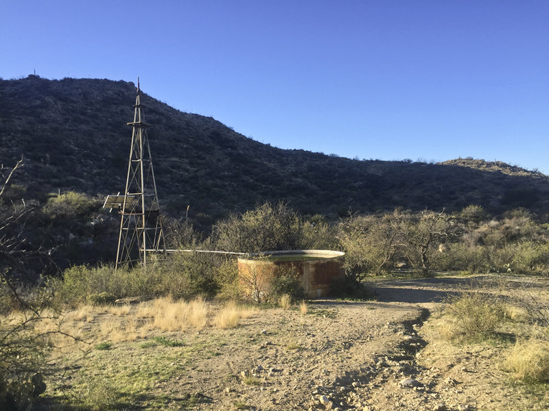 The cattle tank and windmill at the end of the Wild Burro Trail.