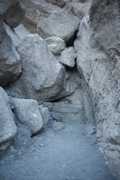 The rockfall appears to block the trail. However, by going to the left and scrambling through some boulders, you can get around it and continue up the canyon.