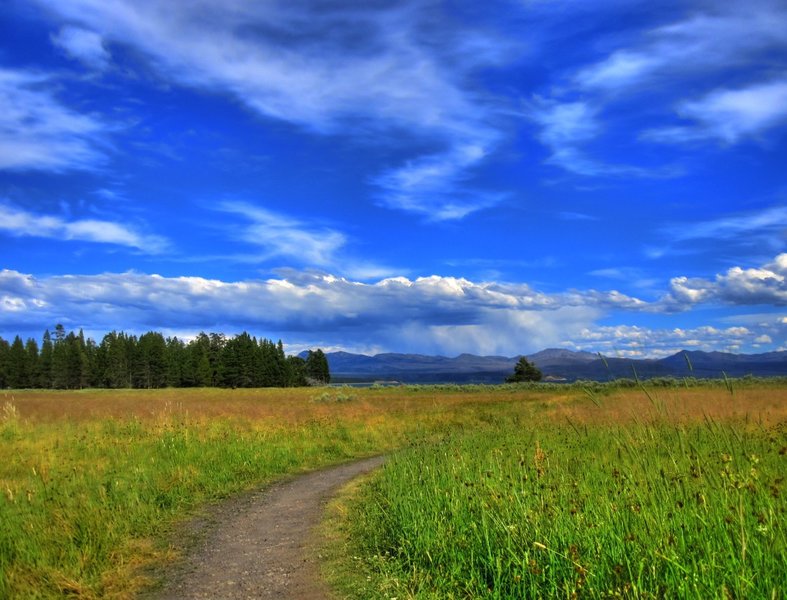 Rain can be seen in the distance from the Mary Mountain-Nez Perce Trail.