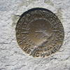 An iconic USGS marker awaits those who summit Mt. Whitney