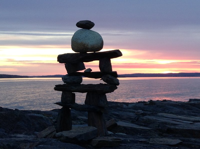 Inukshuk at sunset close to the William F. Schwartz Memorial Point along the Gaff Point Trail.