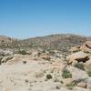 The trail can be hard to follow in places.   Here, rocks mark the path as it moves across smooth rocks.