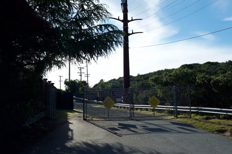 The Sunset Trail starts by entering this gate into the preserve.