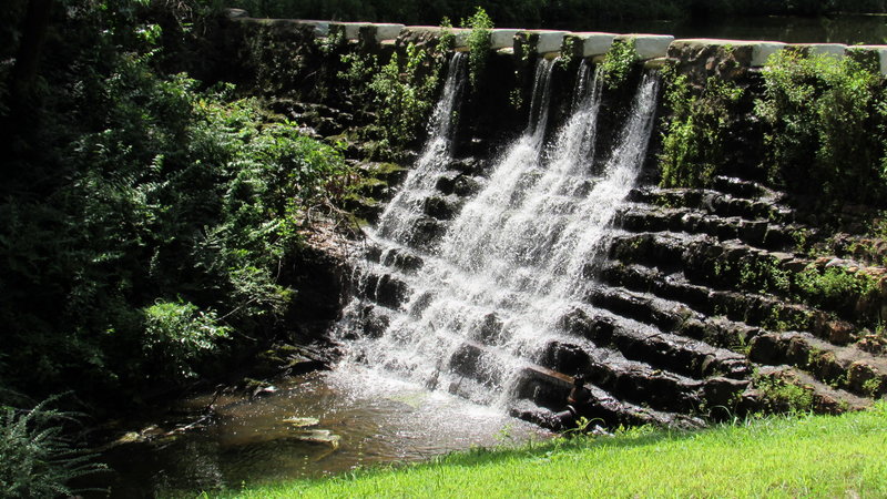 The old stone dam creates Ricks Pond.