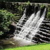 The old stone dam creates Ricks Pond.