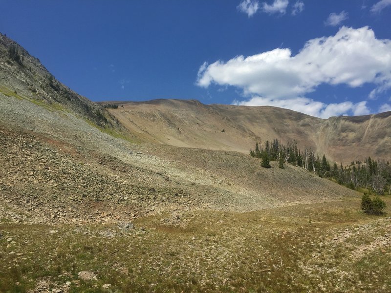 At the foot of a huge amphitheater-like bowl, the top of which is Avalanche Peak.