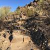 Short, but steep steps, leading to petroglyphs.