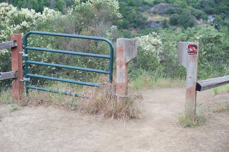 The trail passes through a gate that prevents horses and mountain bikers from accessing it.