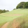 The trail wraps along the hillsides.