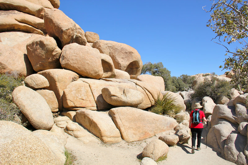 Walking through rock boulders.