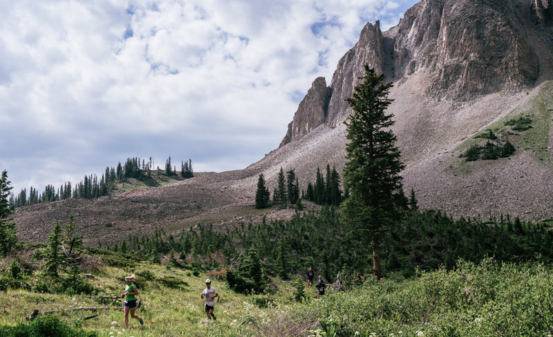 Grin & Bear It racers make their return descent after having arrived at the Green Lake turn around below the Mt. Axtel massif.