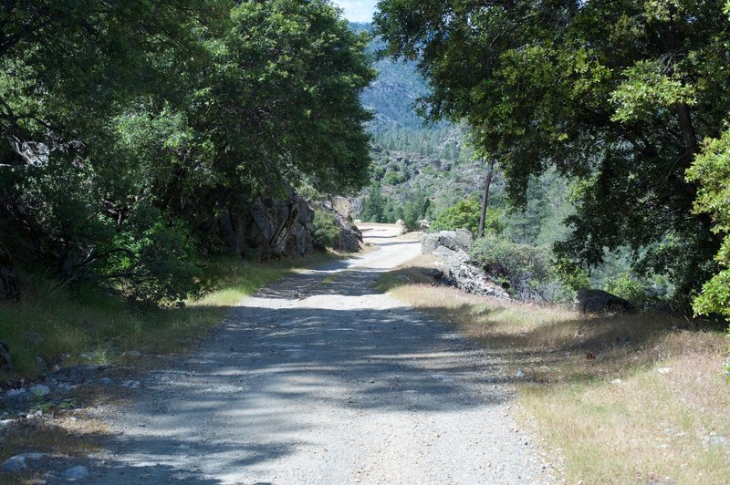 The trail as it descends from the gate by the dam.