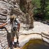 Getting around the deep pools at the top of the dried up waterfall.