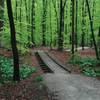 Gravel doubletrack and wooden bridge along route.