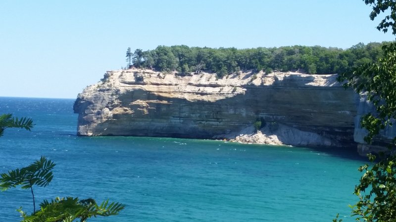 Sandstone cliffs are seen across the water at Pictured Rocks National Lakeshore.