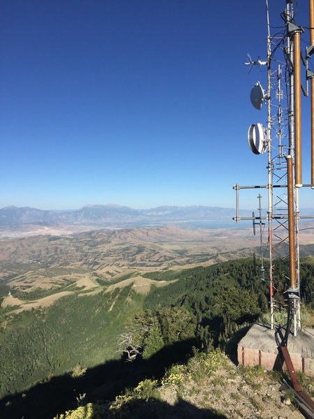 View from summit toward Utah Valley. Utah Lake is visible behind the cell tower.