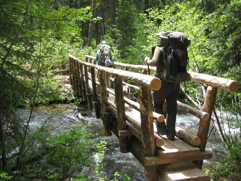 Hikers crossing the Salmon River on Jackpot Meadows Trail.  Photo by Daniel Sanderman