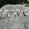 Keep an eye out for this sign on the big rock along this path built out of nearby materials. :) If it's not there - make it!