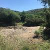 The trail crosses the wash... depending on time of year and weather can be dry or full and flowing really well.