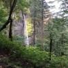 The trail ascends around the falls to the top