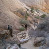 Navigating a section of rocks in Surprise Canyon.